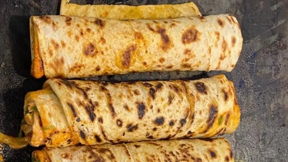 A chicken dürüm crisped on the griddle